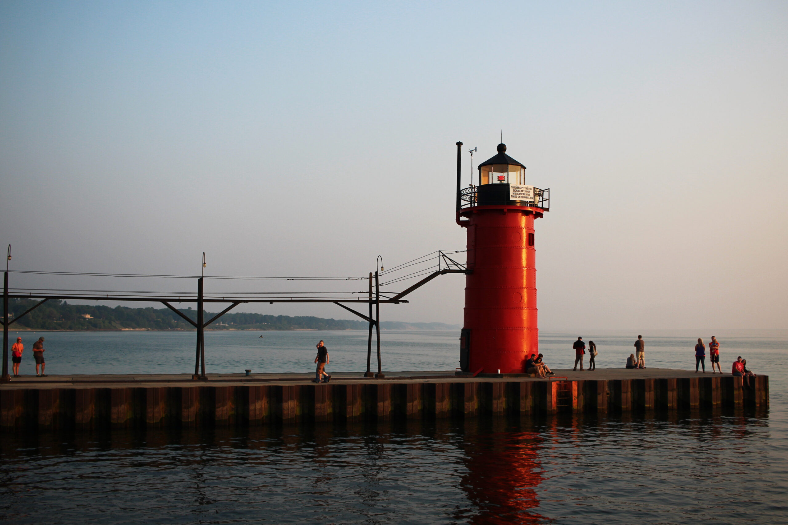 South Haven, Michigan - June 7 2015: People walk to the end of the historic lighthouse.