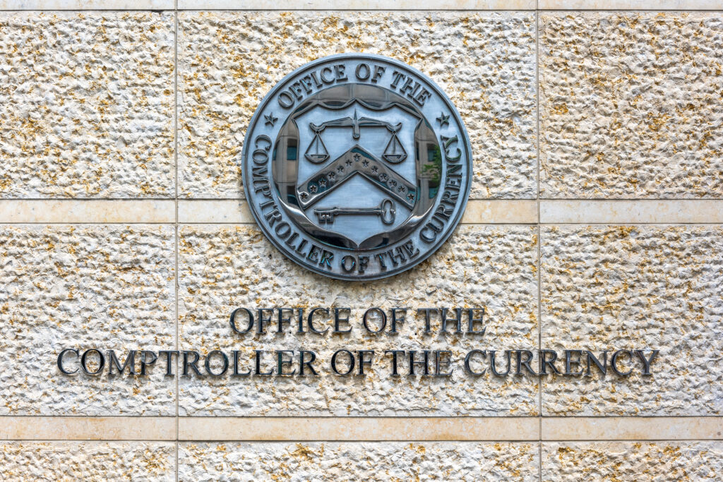 Washington DC, USA - July 3, 2017: Office of the Comptroller of Currency sign and logo in downtown