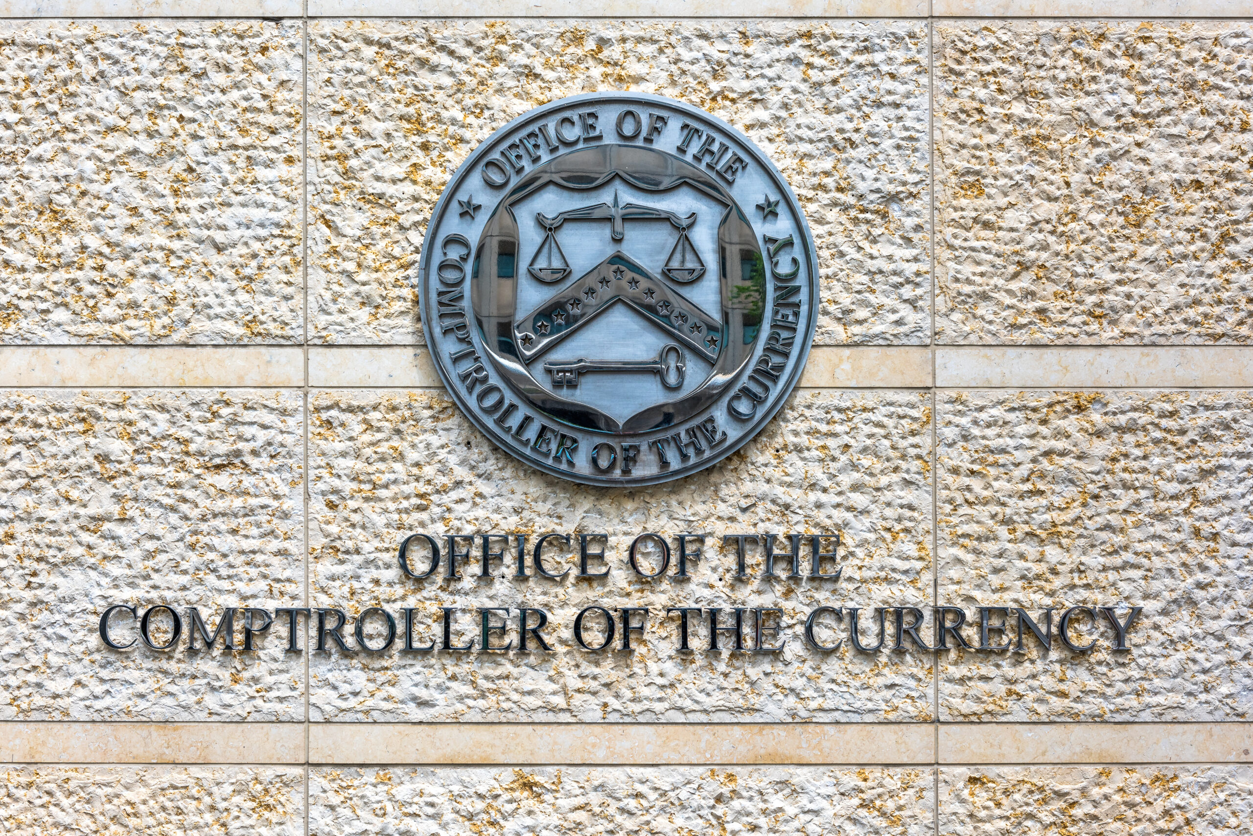 Washington DC, USA - July 3, 2017: Office of the Comptroller of Currency sign and logo in downtown