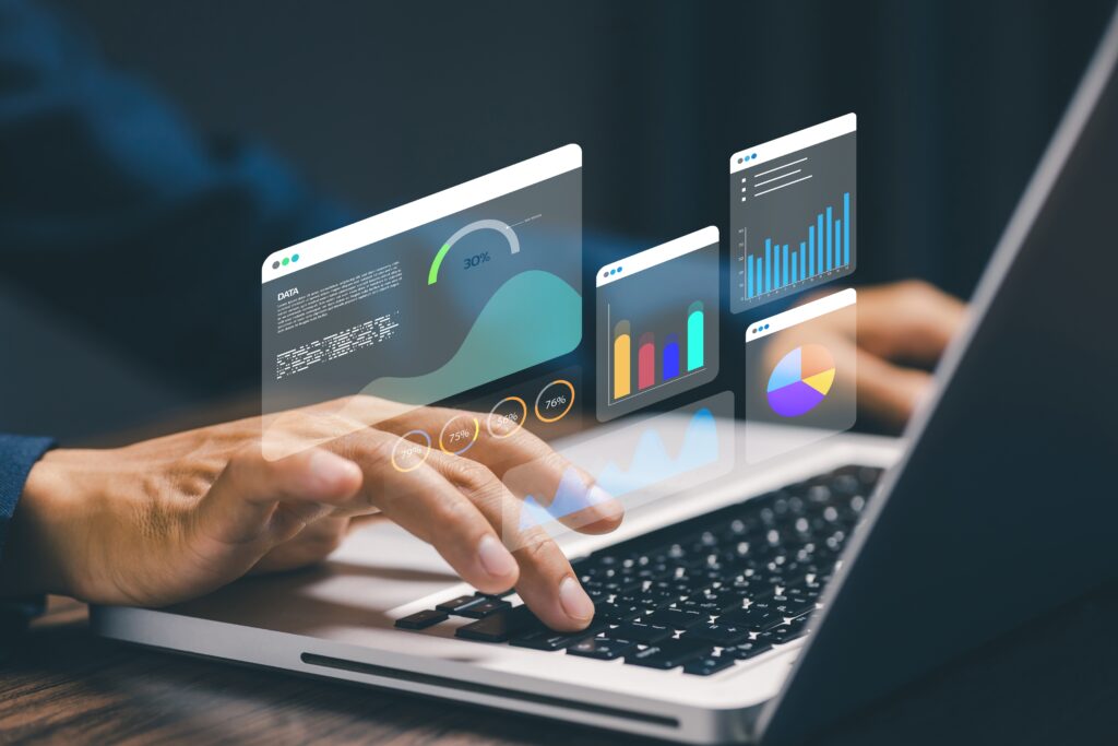 Data analytics dashboard concept with business person using laptop, showing charts, graphs, and performance metrics for business intelligence and data driven decision making.