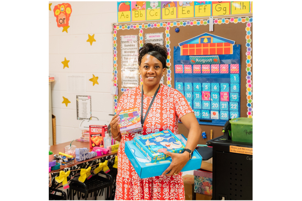 Shanna Roberson, a teacher at Dodge County Primary School, proudly showing off classroom supplies donated through Robins Financial Credit Union’s GRANTED program.